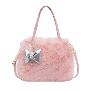 Pink plush crossbody bag with silver bow pendant and adjustable strap for women