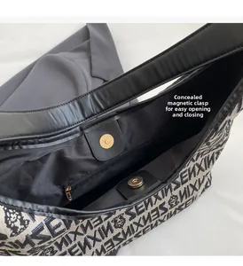 Detail view of the knitted shoulder bag with a magnetic snap and internal zip pocket
