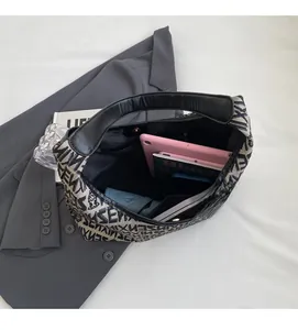 Macro top view of knitted tote bag showing large interior capacity with gadgets