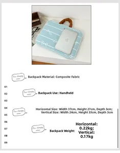 Light blue composite fabric laptop sleeve with white bow print and brown handles
