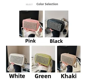 Detail view of stylish PU crossbody bags with silver rivets and colorful woven straps