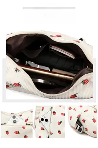 Detail showing spacious interior and pockets of the strawberry corduroy shoulder bag