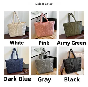Detail view of large quilted tote bags in six colors with classic V-shaped stitching patterns