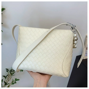 Minimalist cream woven PU leather crossbody bag with pearl charms and wide strap