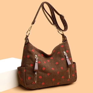 Brown corduroy shoulder bag with strawberry print and adjustable leather strap