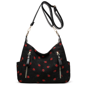 Minimalist black corduroy shoulder bag with red strawberry embroidery and gold hardware