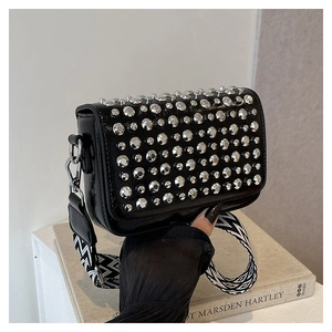 Fashionable black PU leather shoulder bag with silver studs and a wide geometric strap