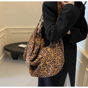Detailed close-up of large capacity leopard print tote bag with soft texture and pattern
