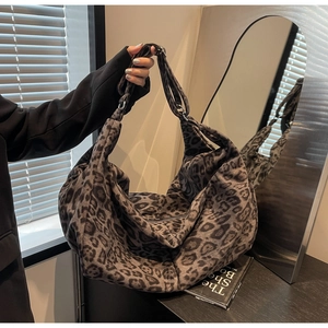 Fashionable dark grey leopard print large PU tote bag with a soft hobo style shoulder design