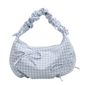 Blue and white checkered crescent handbag with ruffled handle and bow details