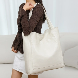 Minimalist white PU leather tote bag with geometric embossed pattern and large capacity