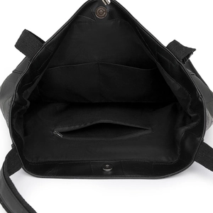 Internal view of a black PU leather tote bag with pockets and magnetic closure