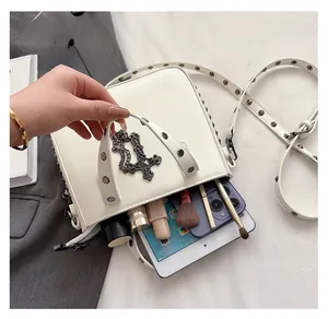 Internal view of the white PU leather handbag showing space for a tablet and cosmetics