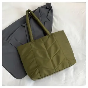 Olive green quilted nylon tote bag with V-shaped stitching for stylish summer commuting