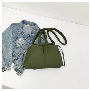 Quilted army green puffy crossbody bag with drawstring handle and nylon texture