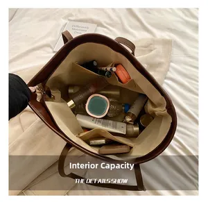 Top view showing the large internal capacity of the dark brown leather tote bag with pockets