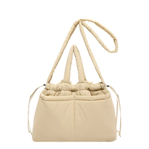 Minimalist beige quilted shoulder bag with drawstring closure and two front pockets
