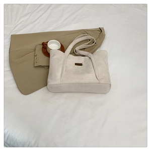 Minimalist cream faux suede tote bag for women featuring a spacious autumn design
