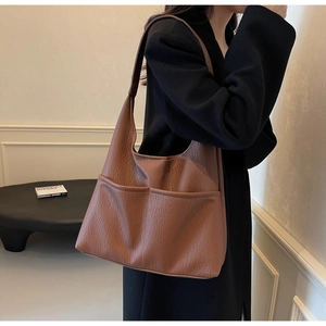 Detail of a brown lychee pattern PU leather Hobo shoulder bag with dual side pockets