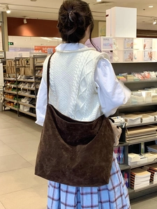 Detailed view of dark brown frosted suede Hobo bag showing large capacity and soft texture