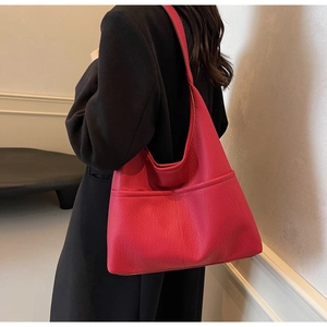 Detailed view of large fuchsia PU leather tote bag with pebble texture for women