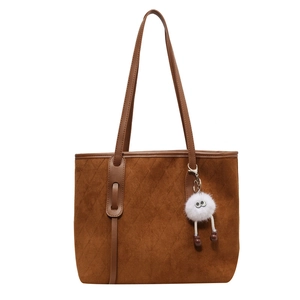 Brown velvet tote bag with diamond quilted pattern and cute white plush toy charm