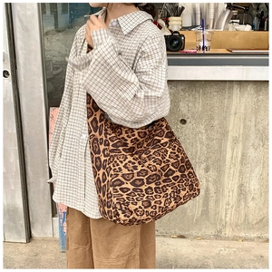 Close-up of leopard print canvas hobo bag showing texture and stylish pattern