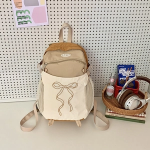 Schicker Schulrucksack mit Schleifenstickerei und Colorblock-Design in Khaki und Cremeweiß