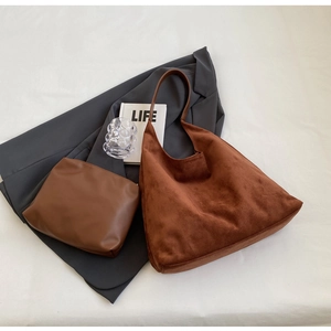 Detailed top view of brown suede tote bag set with matching smooth leather pouch