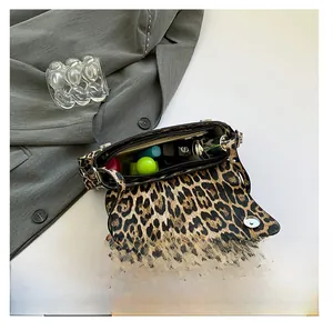 Internal capacity of leopard print PU leather crossbody bag showing daily essentials
