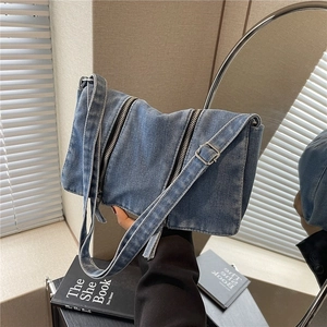 Chic autumn washed denim crossbody bag with dual vertical zippers and wide strap