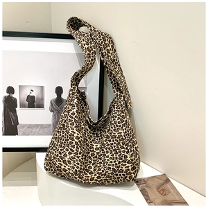 Chic leopard print cotton canvas hobo shoulder bag for women in a stylish art setting
