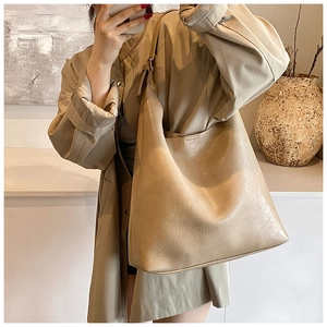 Detail of soft PU leather shoulder tote bag with rich texture and spacious design