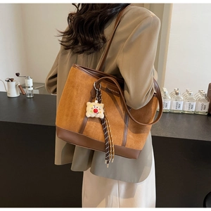 Fashionable brown PU leather tote bag with a cute plush cookie charm accessory