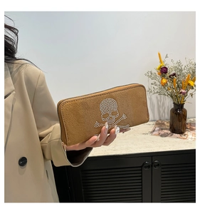 Brown faux suede clutch bag with sparkling rhinestone skull and crossbones design
