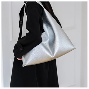 Detail of trendy metallic silver PU leather Hobo shoulder bag with pleated texture finish