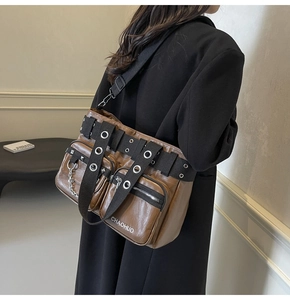 Detail of a brown PU leather shoulder bag featuring metal eyelets and branded CHAOHUO logo