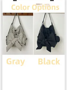 Dual-color display of cloud shoulder bag in grey and black with bow and mini pouch