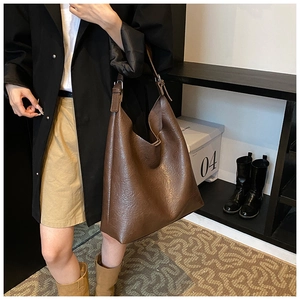 Detailed view of dark brown PU leather Hobo bag with vintage wrinkled texture and metal buckle