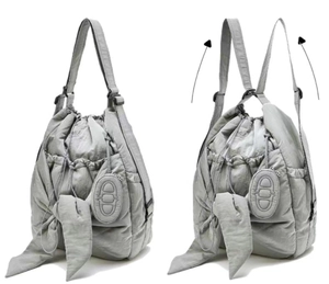 Detailed view of grey quilted nylon bag showing shoulder and backpack strap conversion