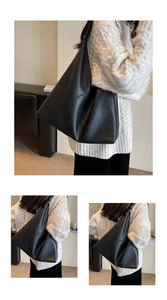 Detail of black geometric patchwork hobo bag with soft leather texture and large capacity