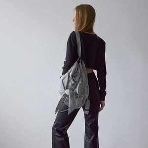 Light gray cloud backpack with side bow ties and textured fabric for casual wear