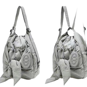 Grey quilted puffer cloud bag with ribbon ties and anchor chain charm pendant