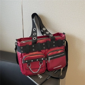 Fashionable burgundy PU leather tote bag with silver metal studs and black canvas strap