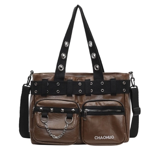 Brown vintage PU leather crossbody bag with wide strap and metallic eyelet details