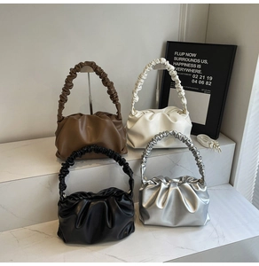 Detail of ruched cloud bags in black, white, brown and silver with scrunchie handles