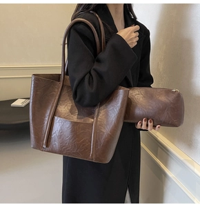 Detail view of deep brown PU leather tote bag set with soft vintage texture