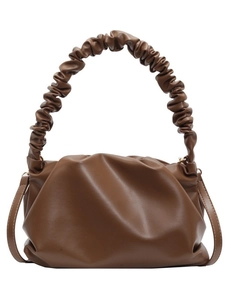 Brown pleated dumpling cloud bag with textured handle and adjustable crossbody strap