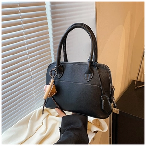 Classic black PU leather shoulder bag with baseball charms and smooth zip closure