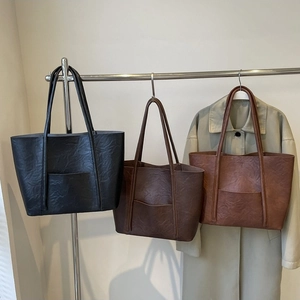 Minimalist fall PU leather tote bags in black, dark coffee, and light brown on display